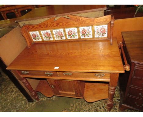 AN EDWARDIAN PINE AND TILE BACK WASHSTAND, W 110 cm