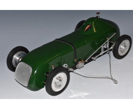 A 1940s M & E Models Ltd tether front wheel drive racing car, special standard  green painted body, standard chassis fitted w