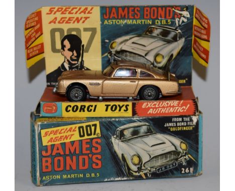 Corgi Toys  - 261 James Bond Aston Martin D B 5 from the Film "Goldfinger", metallic gold body, with ejector seat, bandit and