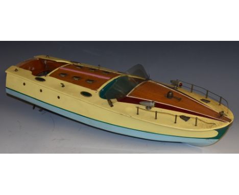 A Japanese TMY toys battery powered Speed Boat, wooden hull and deck, metal fittings, hinged covers and removable rear panel,