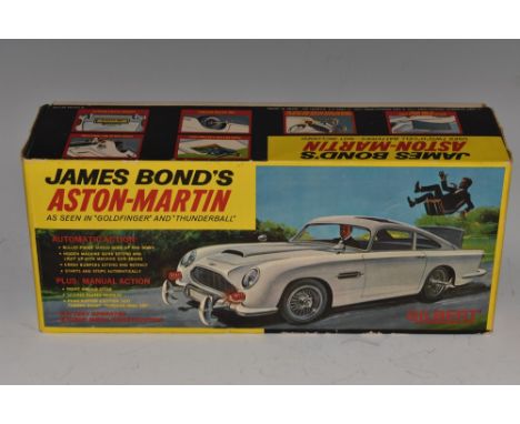 James Bond 007 - a Gilbert (Japan) tinplate battery operated James Bond's Aston Martin DB5 as seen in 'Goldfinger' and 'Thund