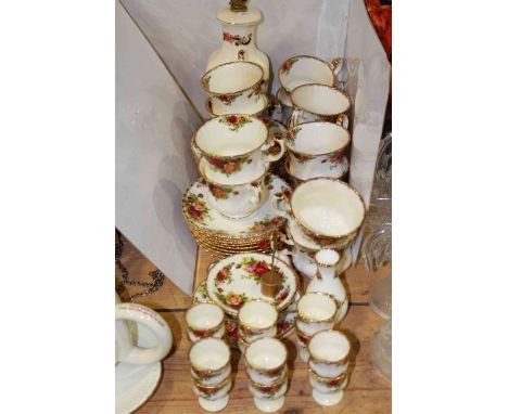 Royal Albert Old Country Roses breakfast china with twelve egg cups and a Masons table lamp