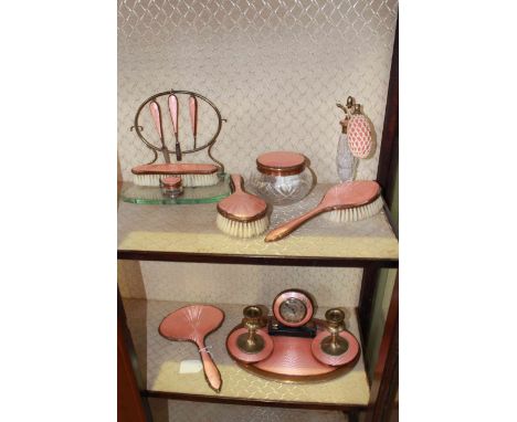 Pink enamel decorated extensive dressing table set including clock and manicure