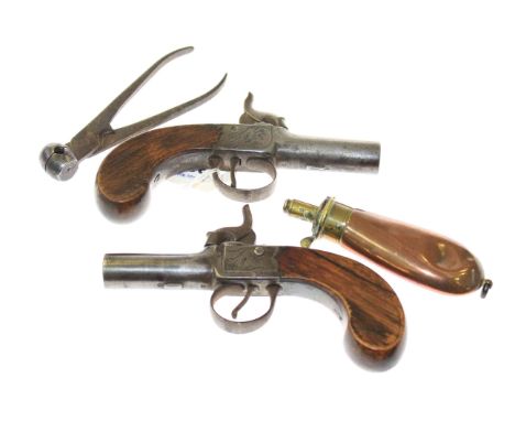 Pair of percussion pistols, small Hawksley copper and brass shot flask and a bullet mould