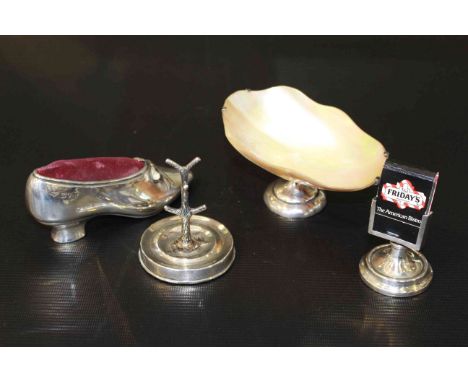 Silver shoe-form pin cushion, silver ring tree, silver matchbox holder, silver and abalone dish (4)