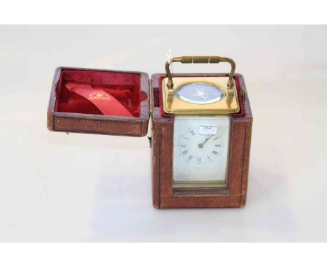 Brass cased carriage clock, signed E. White, Paris, in a leather travelling case