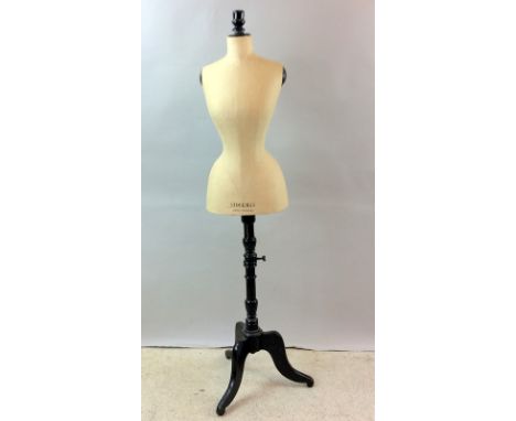 Stockman dress making mannequin with adjustable fit measurement on a wooden trefoil support 