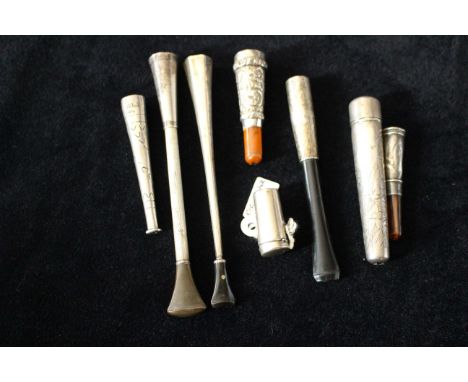 Eight various silver and white metal cheroot/cigarette holders , some with engine turning including a cased telescopic exampl