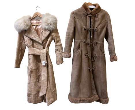 A vintage1970s cow-skin coat with fox fur collar, a vintage 1970s sheepskin coat with frog fastenings (a/f), two pairs of unw