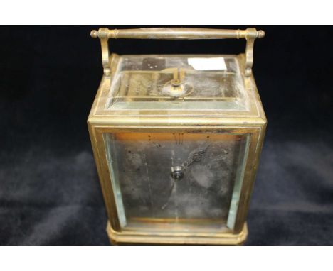 A French eight day gilt brass repeater carriage clock in caddy case, c1840, silvered dial and striking on a bell, the back pl