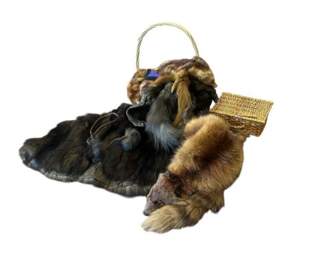A collection of fur items to include&nbsp;&nbsp;a fur cape with high necked collar and braided tie with fur pompoms, a double