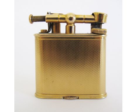 A 9ct. gold Dunhill cigarette lighter, engine-turned, London 1947, 54 grams gross total, H50mm, W48mm. 
Χρυσός αναπτήρας.
Inh