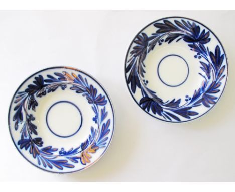 Two French flow blue and lustre ceramic dishes decorated with spinach leafs, marked 'Opaque de Sarreguemines', c19th century.