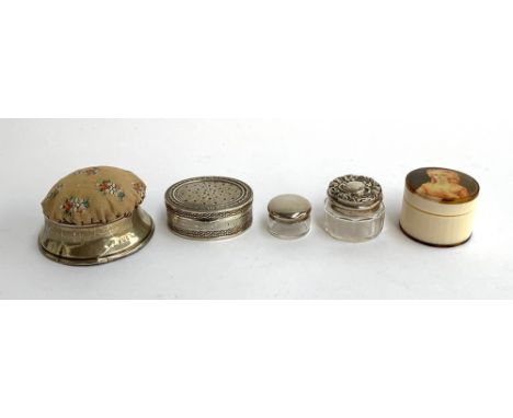 An 800 silver pill box; a silver hallmarked pin cushion; two silver topped glass pots; and a bone trinket pot, the lid with h