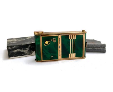 A German Art Deco green marbled enamel camera shaped musical compact, in original box, marked 'La Ronde' 
