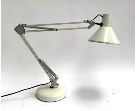 A large white anglepoise lamp 