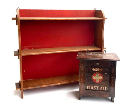 A Sanoid wall mounted first aid box, 28cmW; together with a small oak wall hanging bookshelf of three shelves, 73cmW 