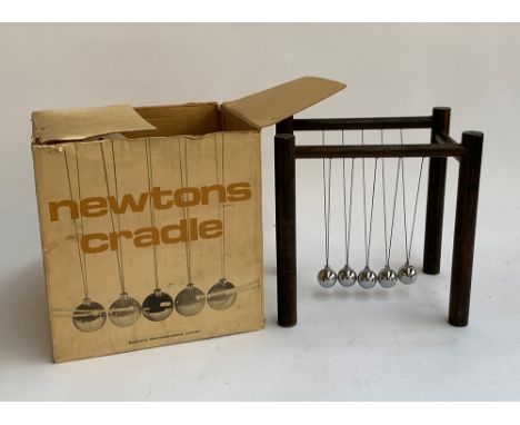 A vintage boxed Newton's Cradle by Scientific Demonstrations Ltd 