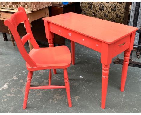 A small side table, with end drawer and turned legs, painted a bright pink, 86x46x70cm; together with a kitchen chair, on rin