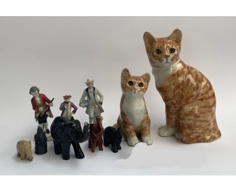 A quantity of ceramic figures including cat, 31cmH and kitten, signed to base, three small continental figurines, carved elep