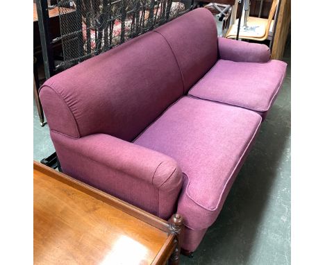 A large purple three seater sofa, 210cmW 