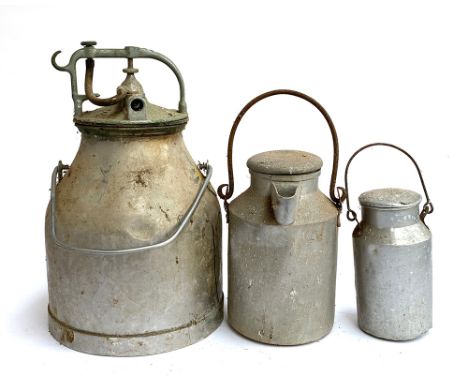 A vintage aluminium milk pail with lid and apparatus, approx. 49cmH; together with two others smaller 