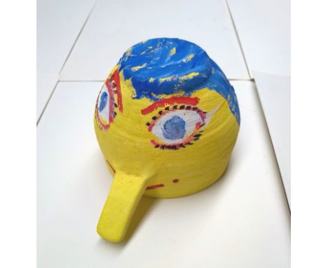 Simeon Stafford, a hand painted ceramic bowl depicting a face, fish painted inside with artist's signature and date, 8cm high