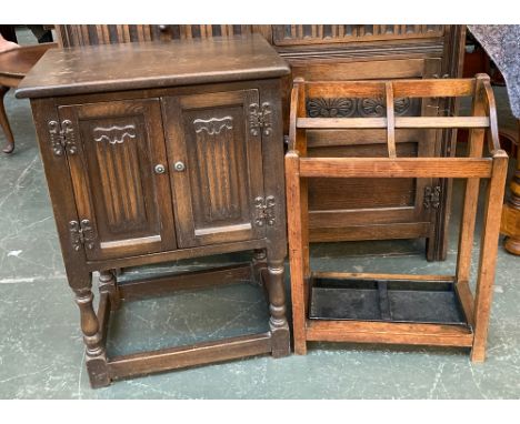 An oak pot cupboard, the doors with linen fold detail, on turned supports and square stretchers, 50x35x71cmH; together with a