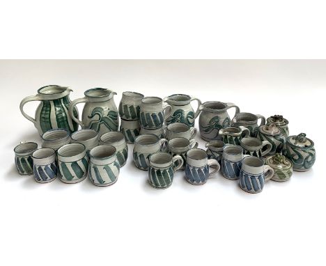 A quantity of&nbsp;Phyllida Horniman pottery, approx. 30 pieces to include lidded pots with frog handles, jugs, cups etc