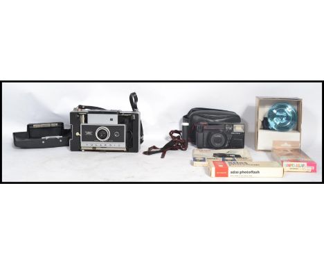 A vintage / retro 20th century cased folding Polaroid 250 automatic land camera together with a boxed Polaroid number 268 fla