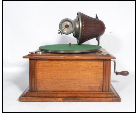 A vintage early 20th century rare table top Gramophone by Nirona. The tin soundbox and horn system contained in one swivellin