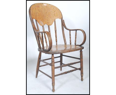 A Victorian bentwood panel back office desk chair - armchair being raised on turned legs with panel seat and back rest flanke