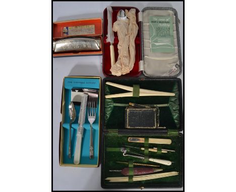 A 19th century cased vanity necessaire set having various needles picks glove stretcher etc along with a 19th century Murano 