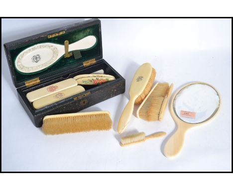 A collection of late 19th / early 20th century Ivory and Ivorine ladies hand held dressing table brushes and mirrors to inclu