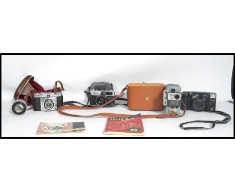 A collection of vintage cameras to include a Zeiss Ikon Contina, a vintage Eumig Servomatic and an Olympus 35DU slr camera al