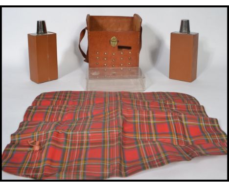 A unusual 20th century drinks flask picnic set held within a vintage pig skin bag. Consisting of two flask and toddy cups / d