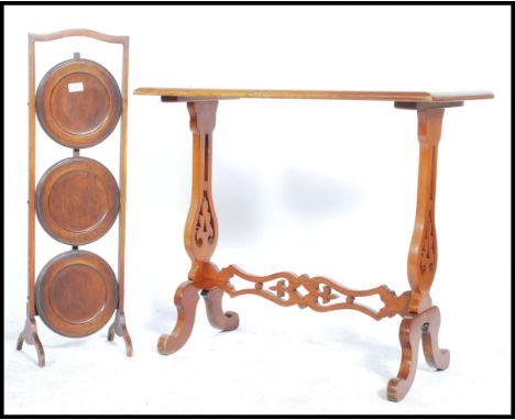 A 19th century Victorian mahogany writing table desk /&nbsp; side table raised on pierced and scrolled legs along with a meta