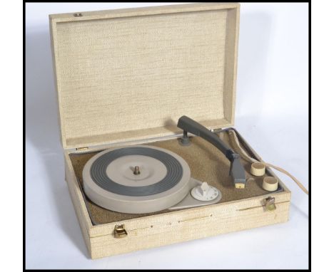 A vintage retro 20th century electric record player. The portable record deck housed within a vinyl case.