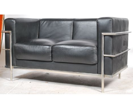 After Le Corbusier - An 'LC2 ' type black vinyl leather and chrome 2 seat sofa settee. The polished chrome tubular frame with