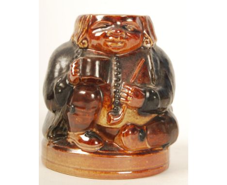 A Doulton Lambeth Toby Harry Simeon Inkwell modelled in a seated position smoking a pipe. Impressed marks 552.  Note; from an
