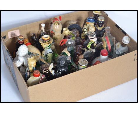 A group of vintage 20th century drinks miniatures to include Beswick bull , seal etc. studio art glass animals etc. Please se