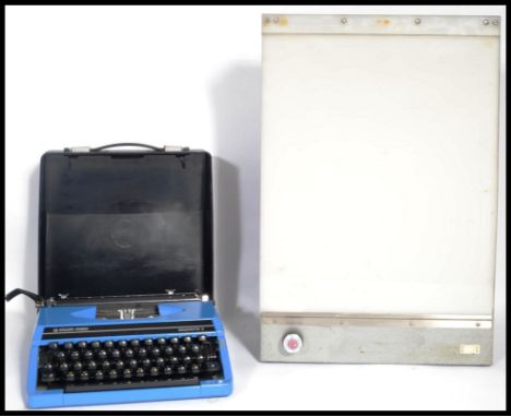A vintage 20th century retro industrial / medical light box along with a vintage 1960's cased typewriter.&nbsp;Measures 54cm 