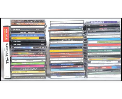 A collection of Compact Discs featuring various artists to include Blur, The Charlatans, David Gray, Dodgy, Alanis Morissette