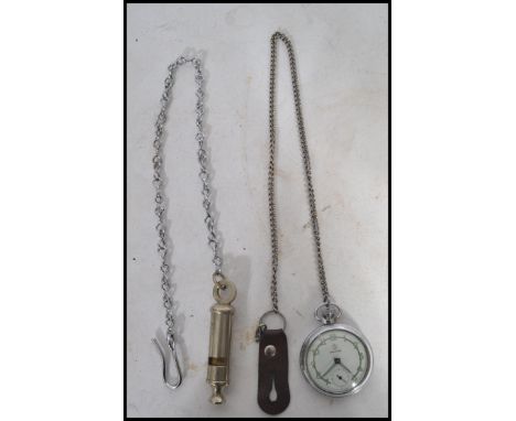 A vintage 20th century WW2 Second World War military Services pocket watch along with two vintage whistles. Longest measures 