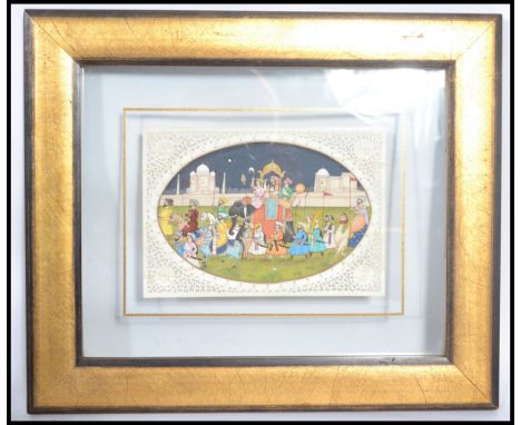 A framed and glazed early 20th century Rajasthani hand painted on Ivory panel painting depicting Moghul warriors and elephant