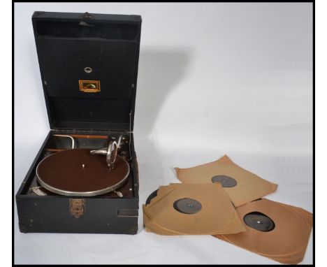 A vintage early 20th century HMV His Masters Voice cased portable gramophone with hinged lids and chrome record arm. Measures