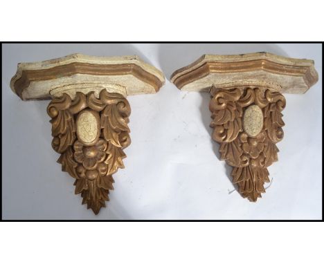 A pair of 19th century Victorian wall sconces / bracket shelves of scrolled form with serpentine tops and gilt detailing.