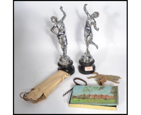 A pair of vintage 20th century chrome classical figurines on stepped pedestal bases along with a vintage Scouting Wolf flag p