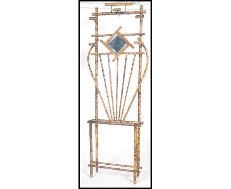 A 19th century Victorian Art Nouveau bamboo hallstand / hall stand. Central diamond mirror with vase detail having stick stan