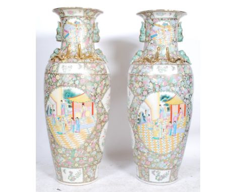 A pair of&nbsp; large 20th Century Chinese famille rose floor standing twin handled vases - vase each having panels decoratin